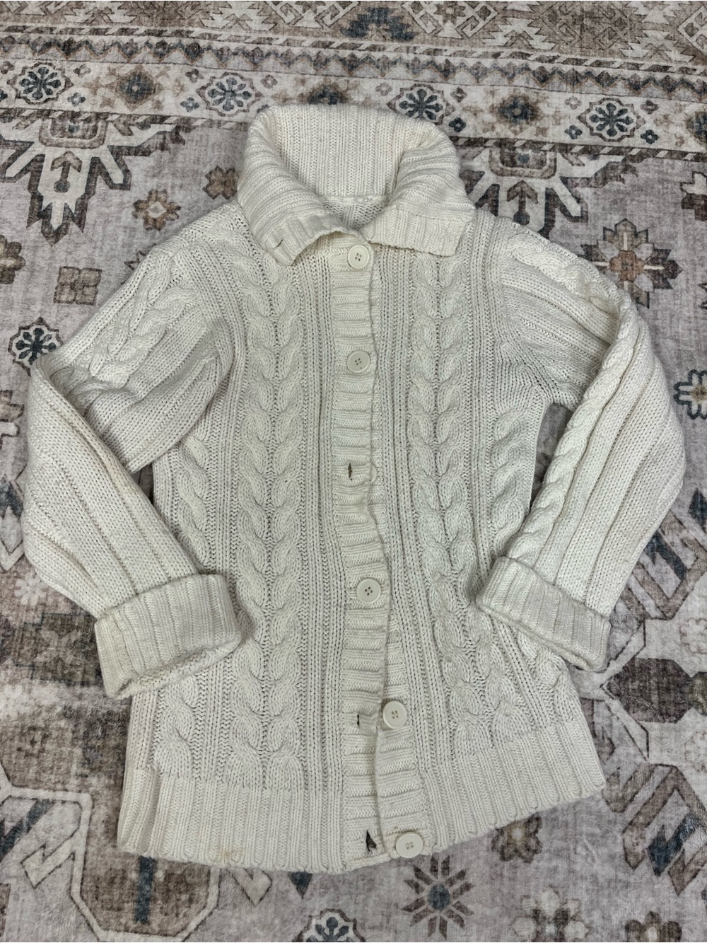 cream-coloured cable knit collared cardigan